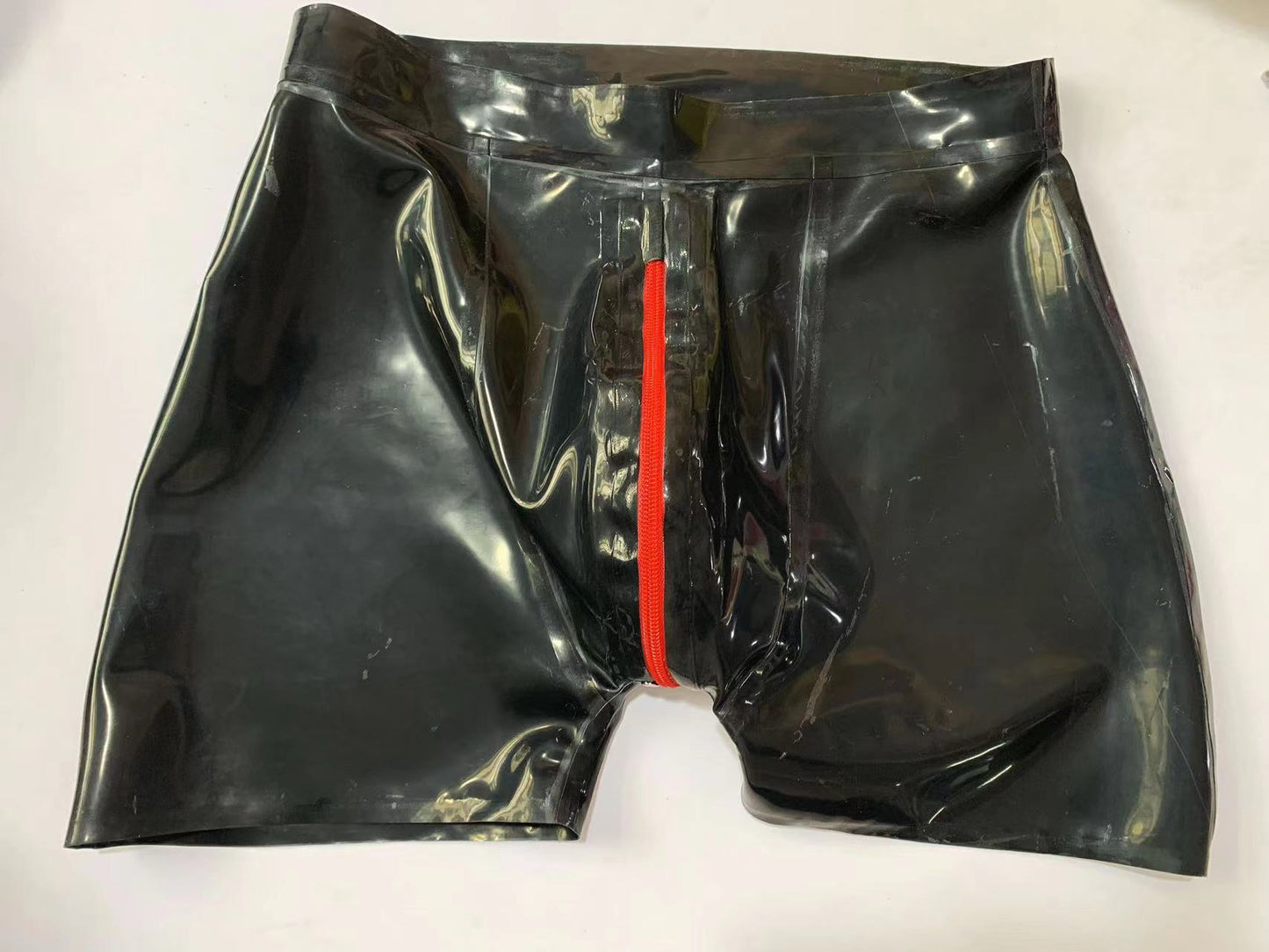 a black latex shorts with zipper