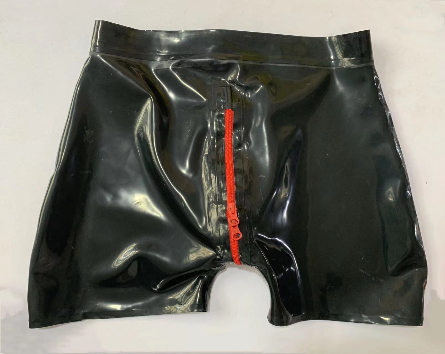 a black latex shorts with zipper