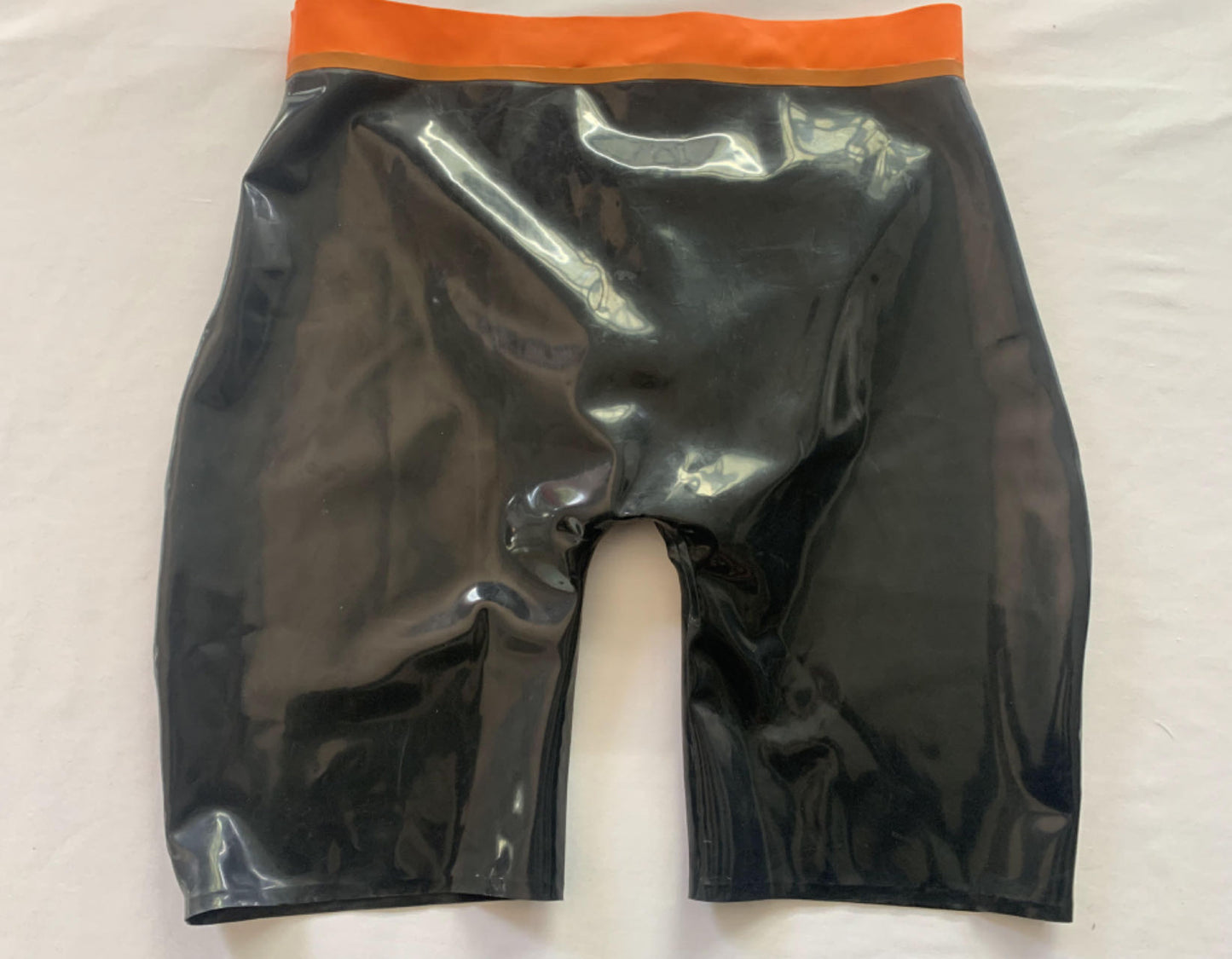 a black mens latex shorts
