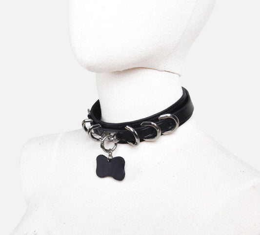 a black leather bondage collar and leash