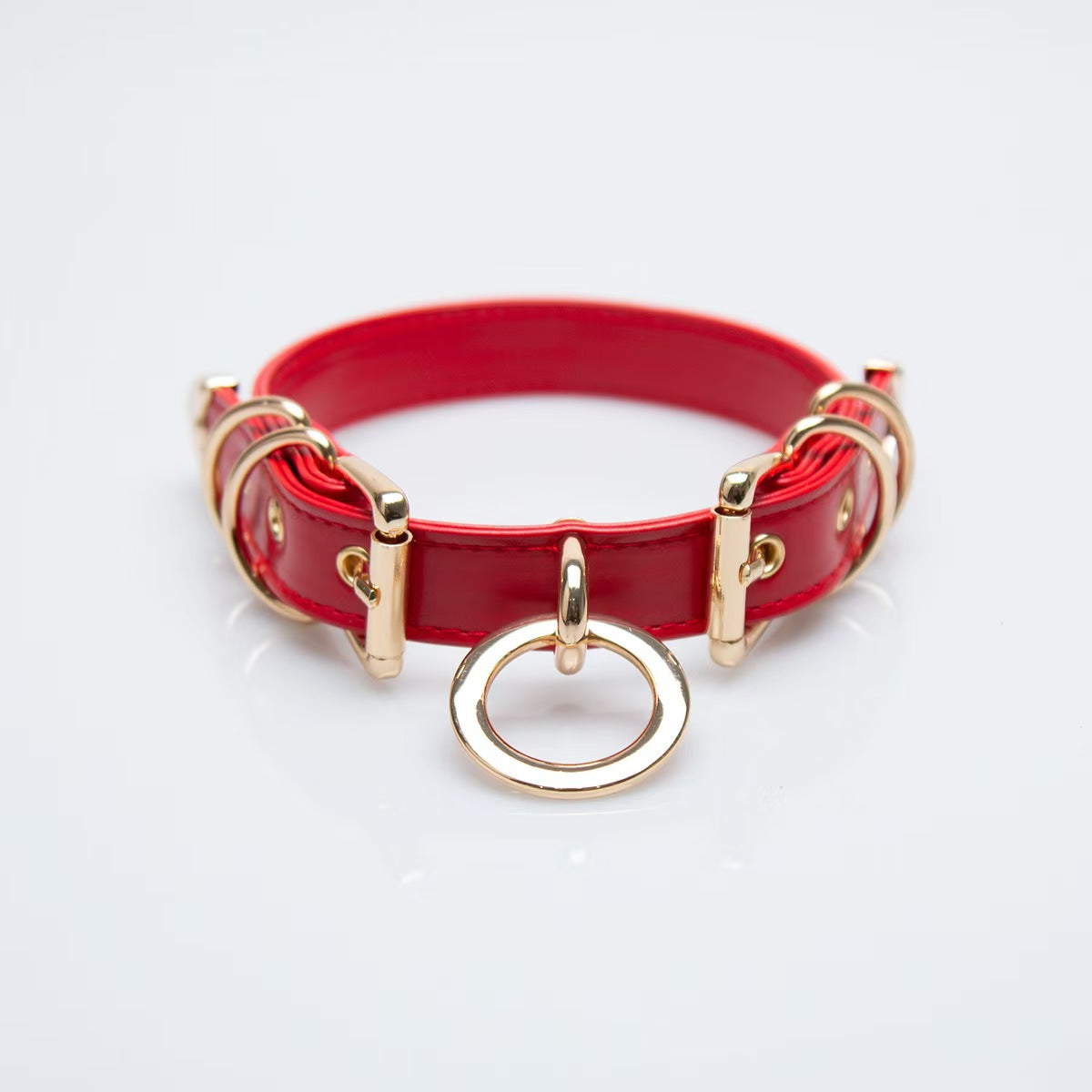 red faux leather o ring collar choker with polished gold alloy buckles on model neck front view
