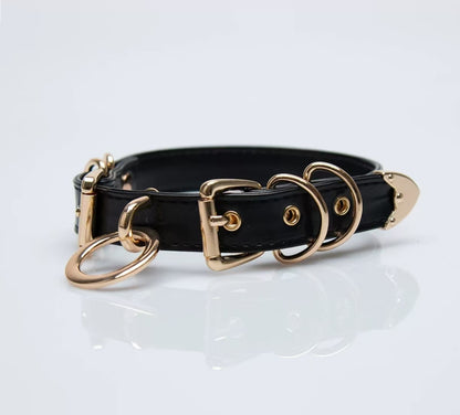 black faux leather o ring collar choker with polished gold alloy buckles on model neck front view