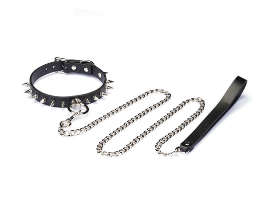 a black spiked choker with ring