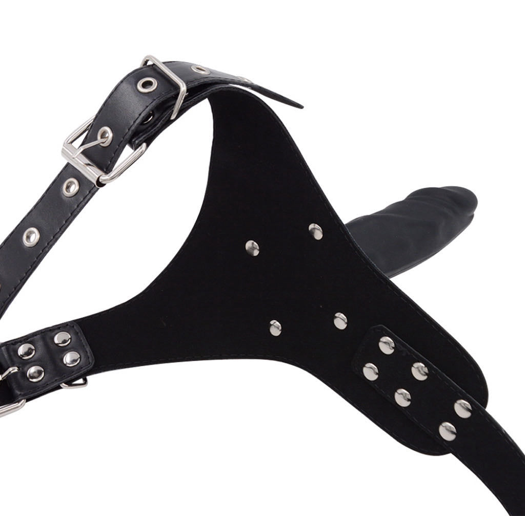 a strap on dildo harness with black dildo