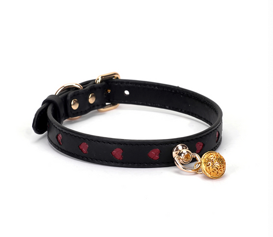 a black Bondage Day Collar with red heart
